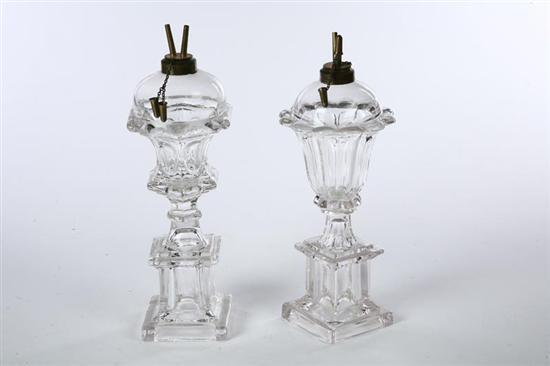 Appraisal: TWO OIL LAMPS American mid th century clear pressed glass