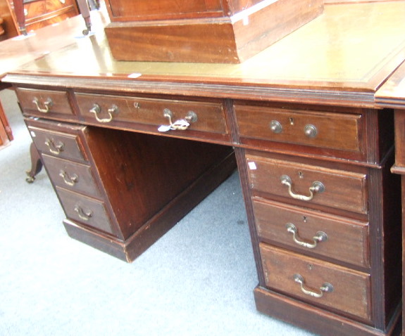 Appraisal: A th century mahogany pedestal desk the tooled green leather