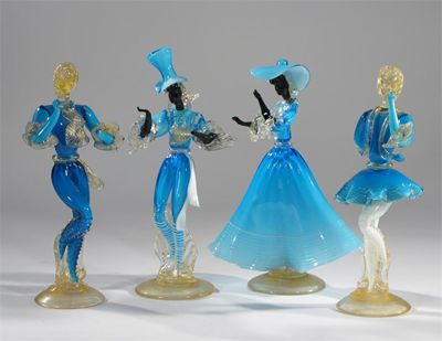 Appraisal: Four Murano glass figures each modelled in blue glass elaborate