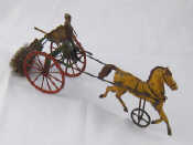 Appraisal: A vintage tinplate push along trotting horse and sulky towing