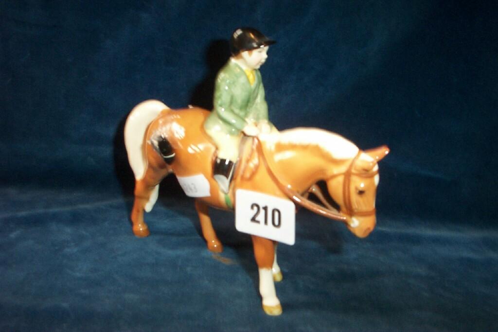 Appraisal: A Beswick model of a little boy in a green