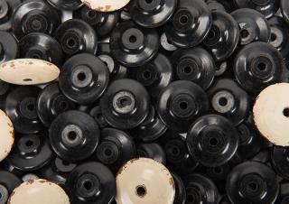 Appraisal: Black Clay Faro Beads Eight White Wood Beads Black beads