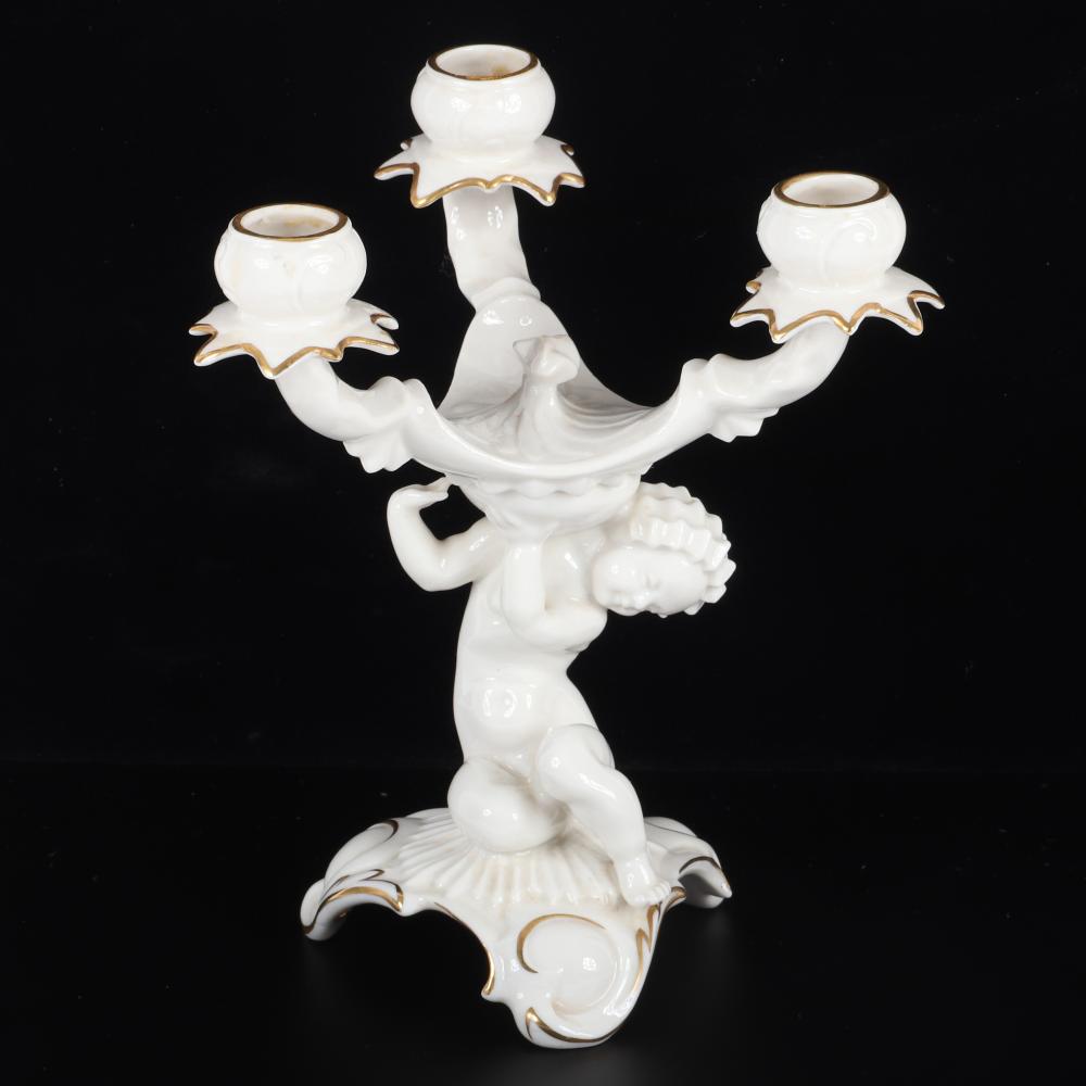 Appraisal: HUTSCHENREUTHER GERMAN PORCELAIN PUTTI CANDLESTICK WITH GILT TRIM ORIGINAL PAPER