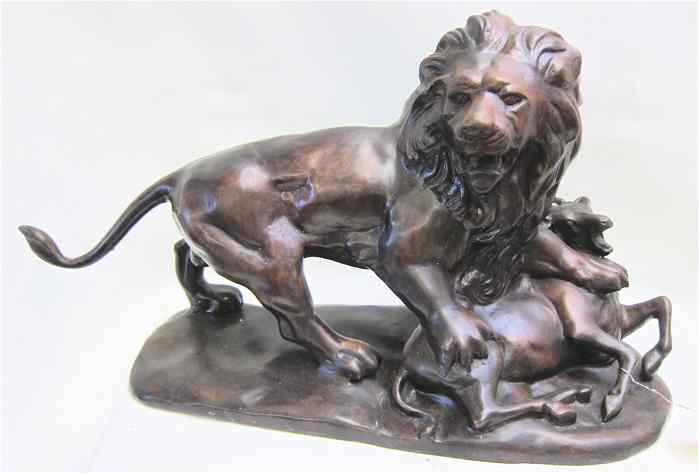 Appraisal: LARGE BRONZE SCULPTURE DEPICTING AFRICAN MALE LION over its kill