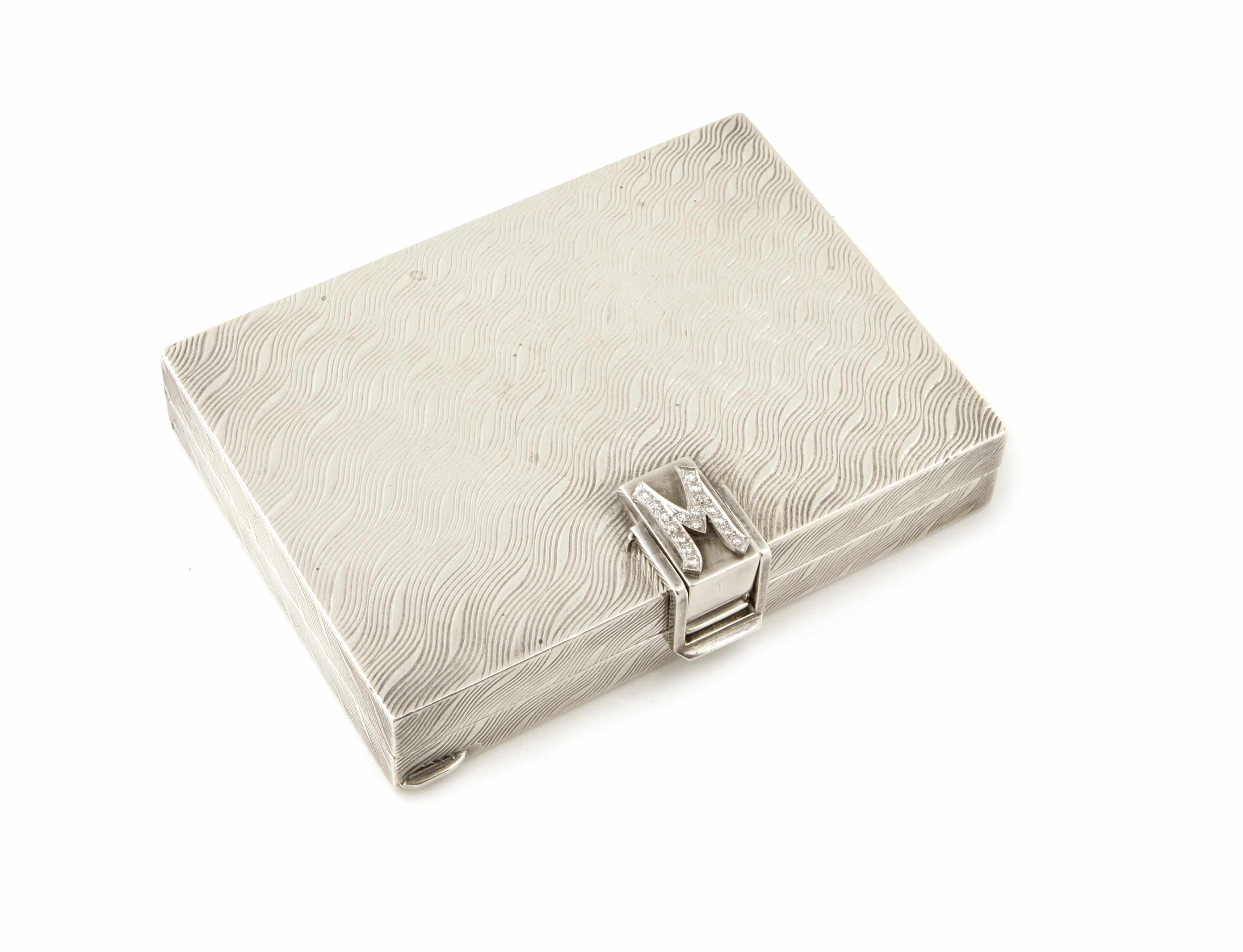 Appraisal: A silver and diamond minaudiere Ann Miller opening to reveal