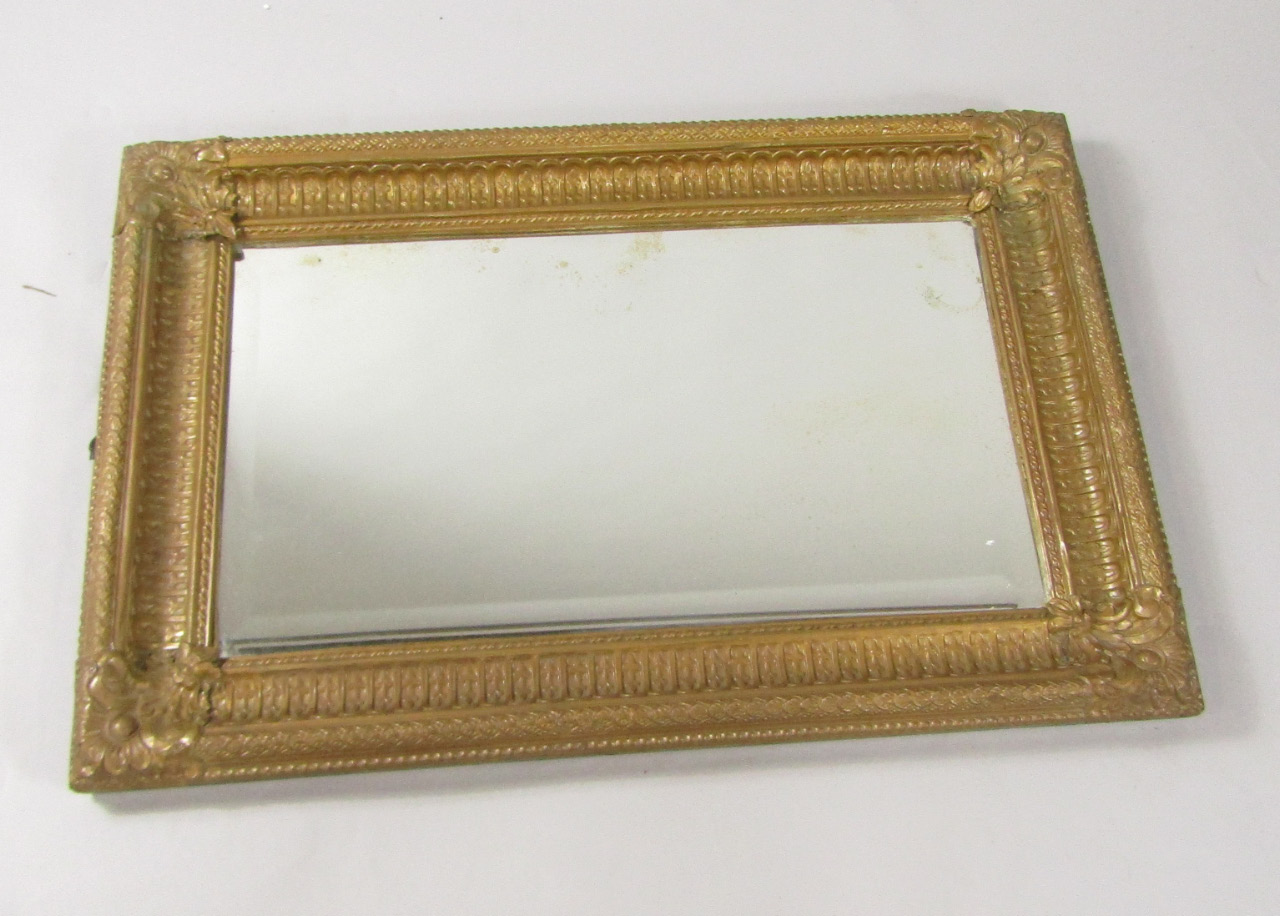 Appraisal: A Victorian gilt metal fronted rectangular wall mirror inset with