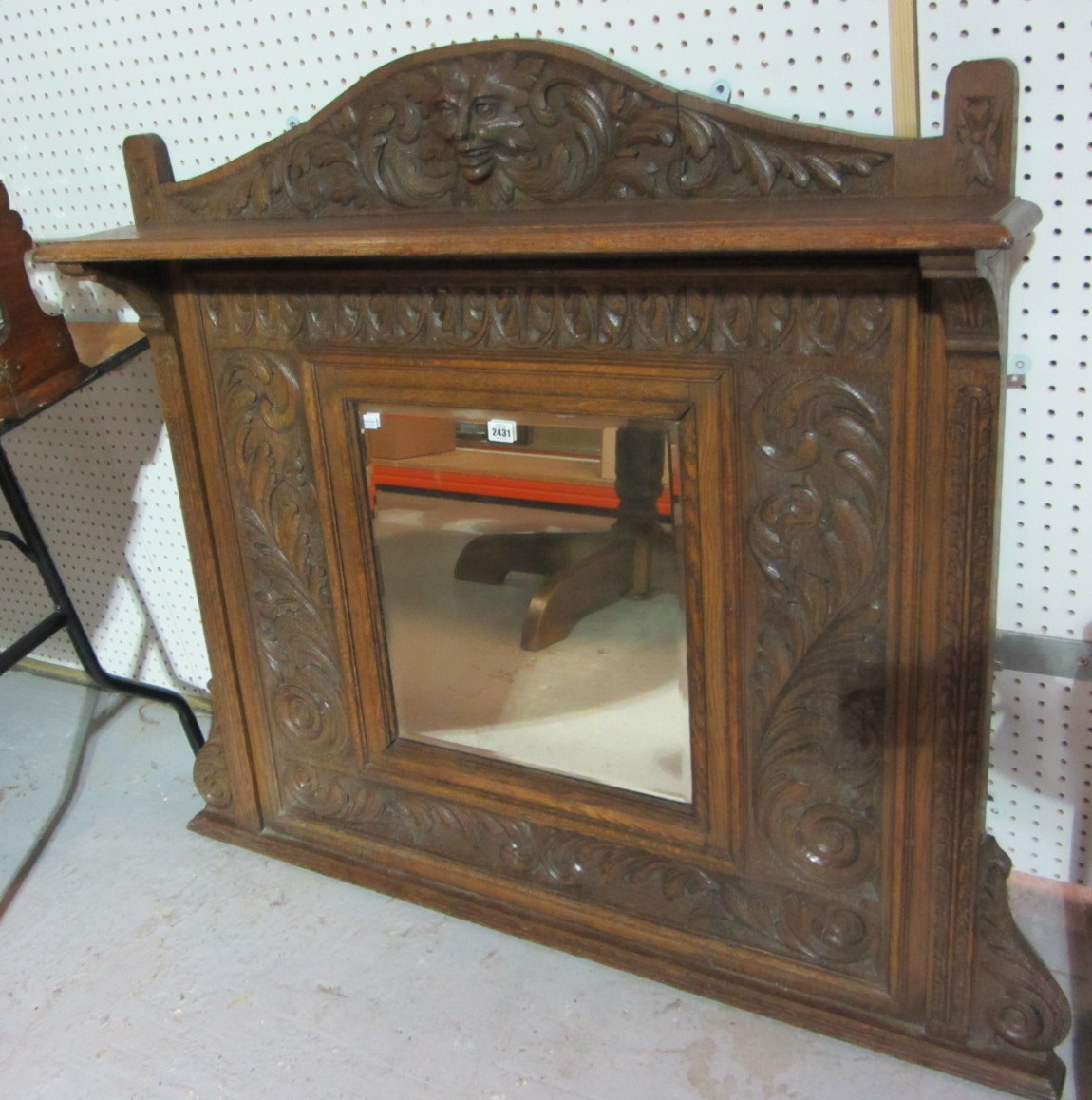 Appraisal: A Victorian carved oak overmantel mirror with bevelled plate