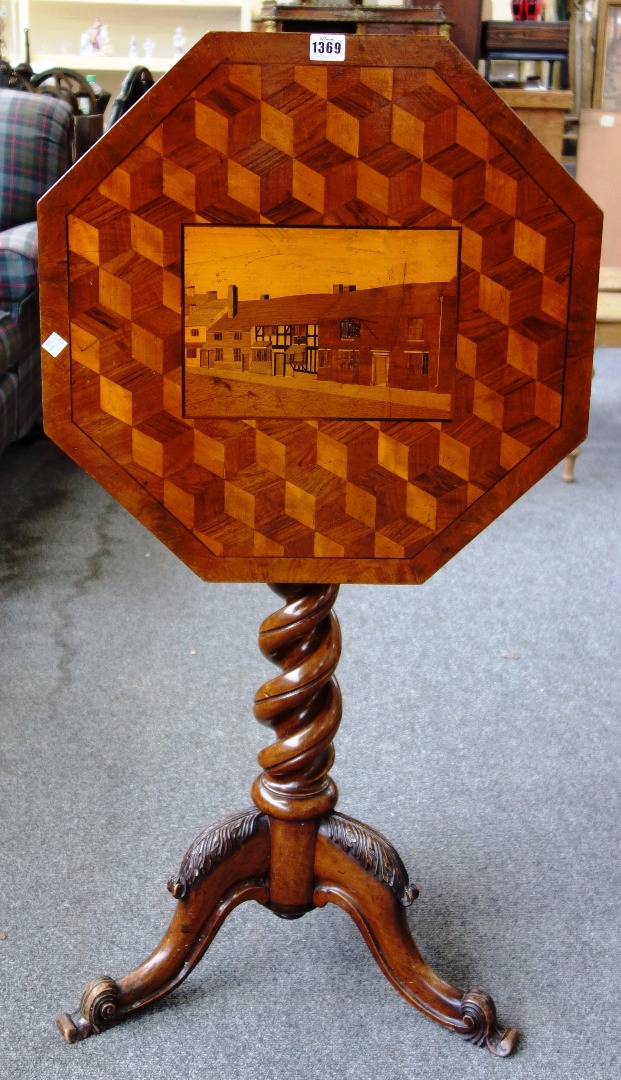 Appraisal: A Victorian walnut occasional table the deceptive cube parquetry inlaid