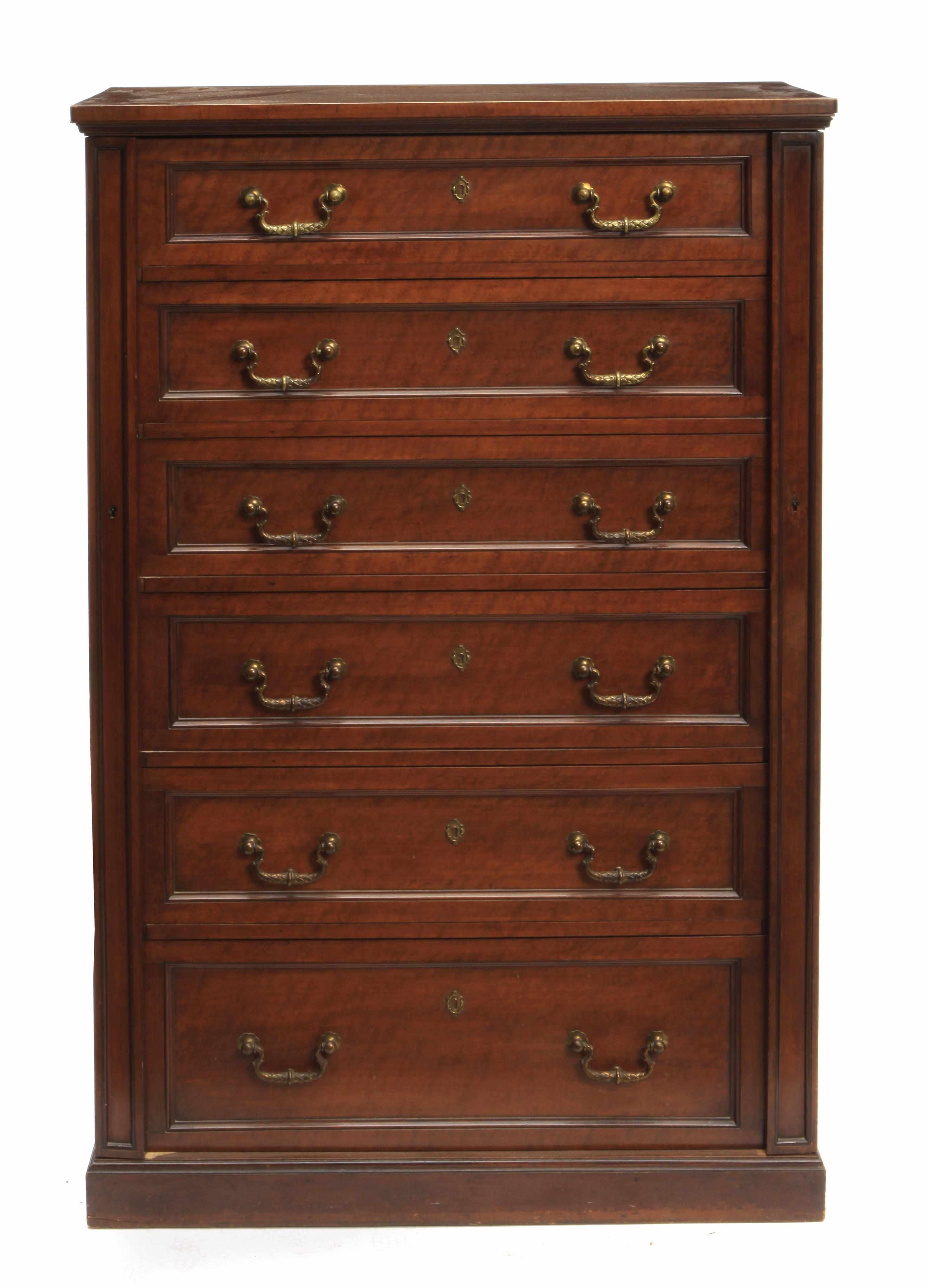 Appraisal: An English fruitwood Wellington chest height in width in depth