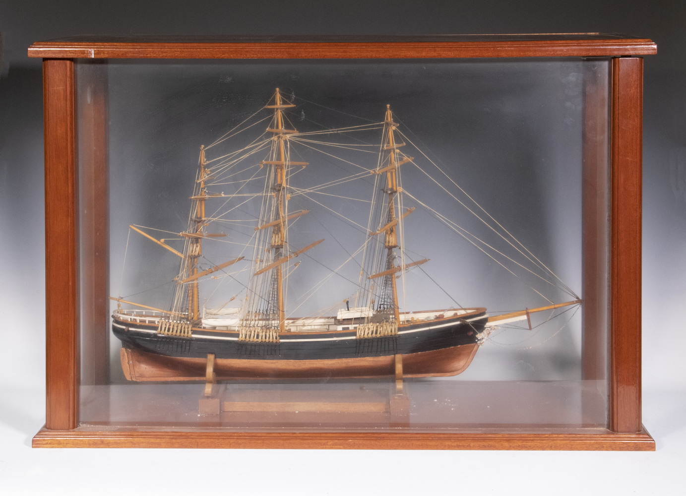 Appraisal: CASED SHIP MODEL Hand Crafted Rigged Three-Mast Sailing Ship circa