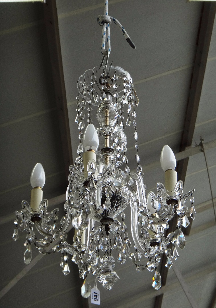 Appraisal: A cut glass five branch chandelier th century the baluster