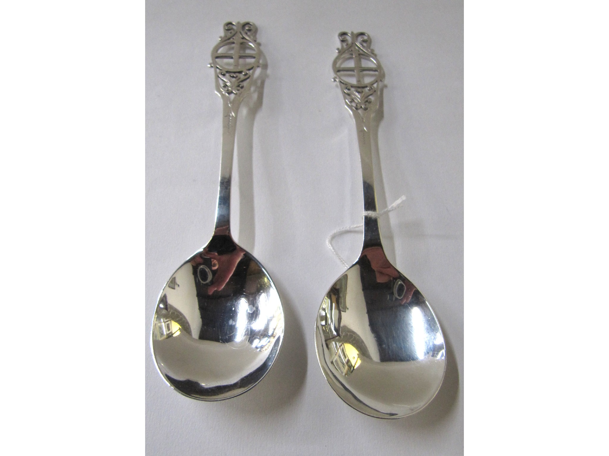 Appraisal: A pair of silver soup spoons with pierced finials Sheffield