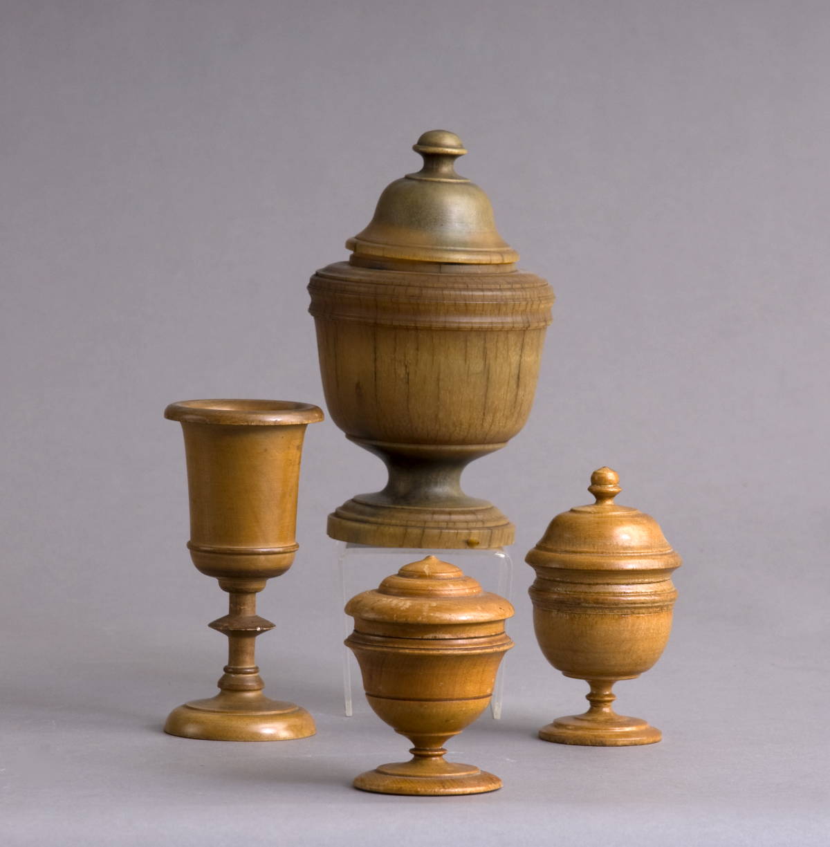 Appraisal: THREE TREEN COVERED URNS AND A GOBLET Height of tallest