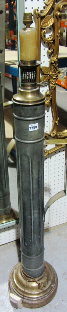 Appraisal: A French brass standard lamp with column and handle