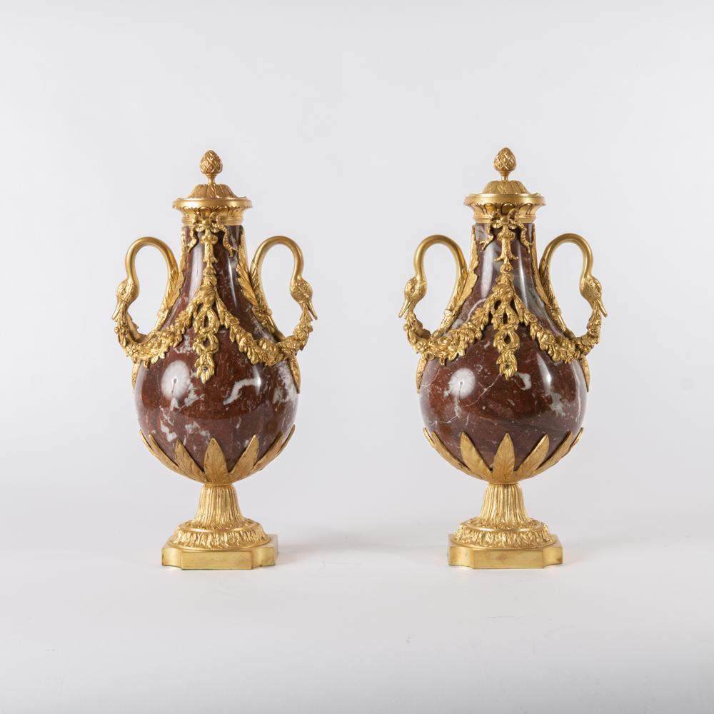 Appraisal: TH C MARBLE ORMOLU URNS PAIR A pair of carved