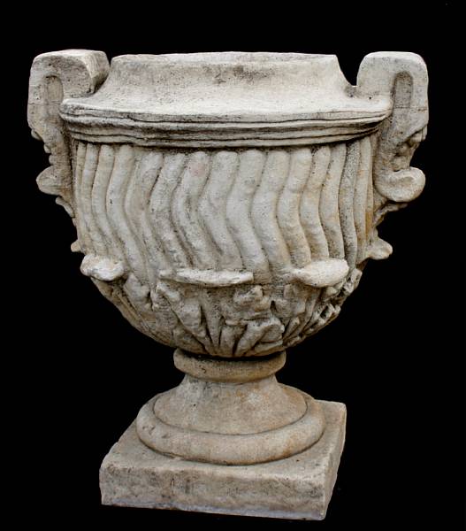 Appraisal: A pair of Neoclassical style cast stone garden urns height