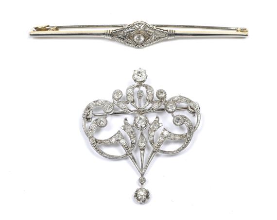 Appraisal: TWO DIAMOND BROOCHES circa Platinum on yellow gold Decorative pierced