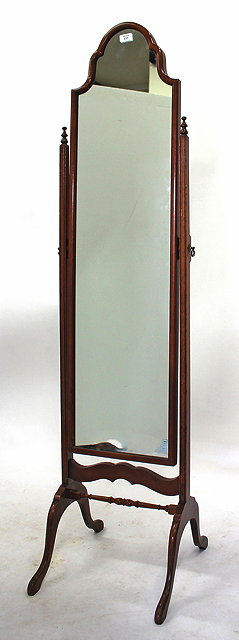 Appraisal: A NARROW HARDWOOD FRAMED CHEVAL MIRROR with shaped top and