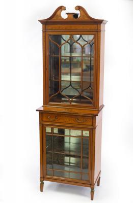 Appraisal: An Edwardian satinwood display cabinet the broken swan neck pediment