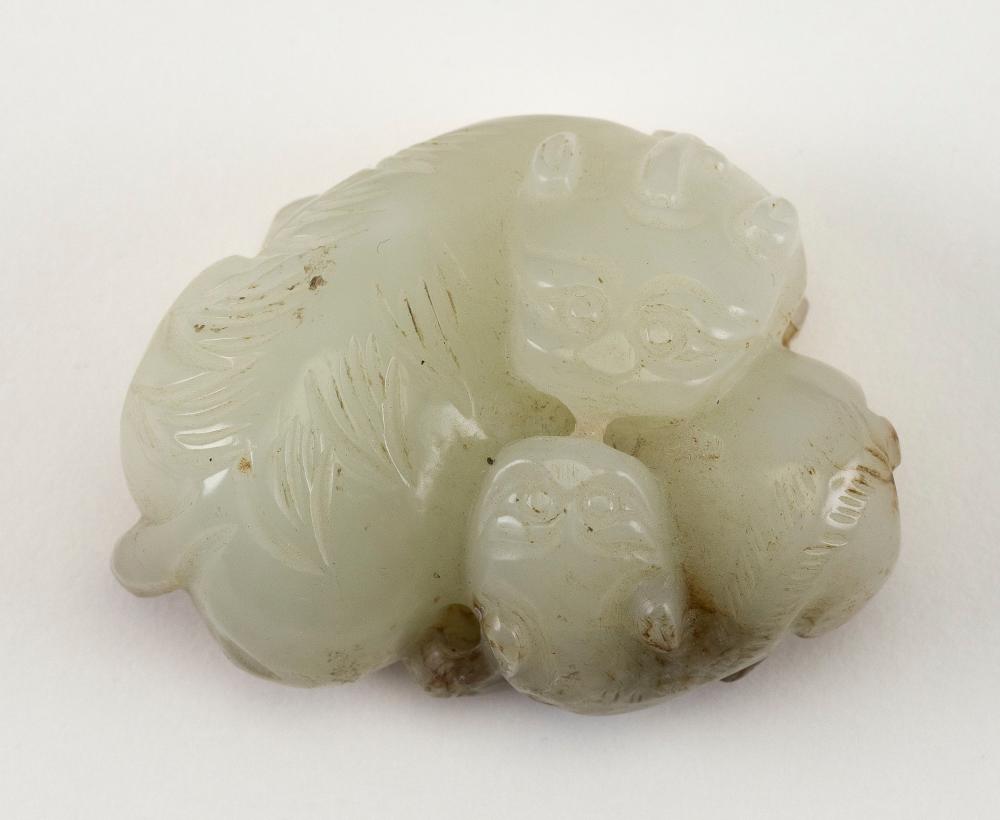 Appraisal: CHINESE CARVED PALE JADE GUARDIAN LION WITH PUP TH CENTURY