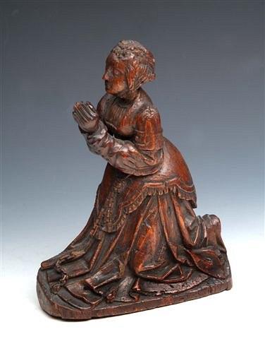 Appraisal: A NORTH EUROPEAN OAK CARVING of a woman in prayer