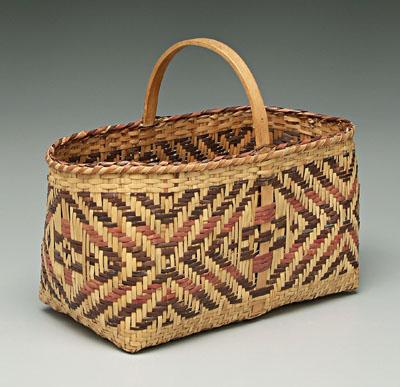 Appraisal: Cherokee river cane basket red and brown weavers in conforming