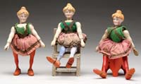 Appraisal: THREE SCHOENHUT BISQUE HEADED FEMALE ACROBATS A nice grouping of