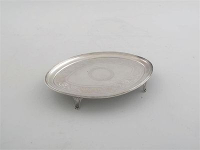 Appraisal: A George III oval teapot stand with an engraved band