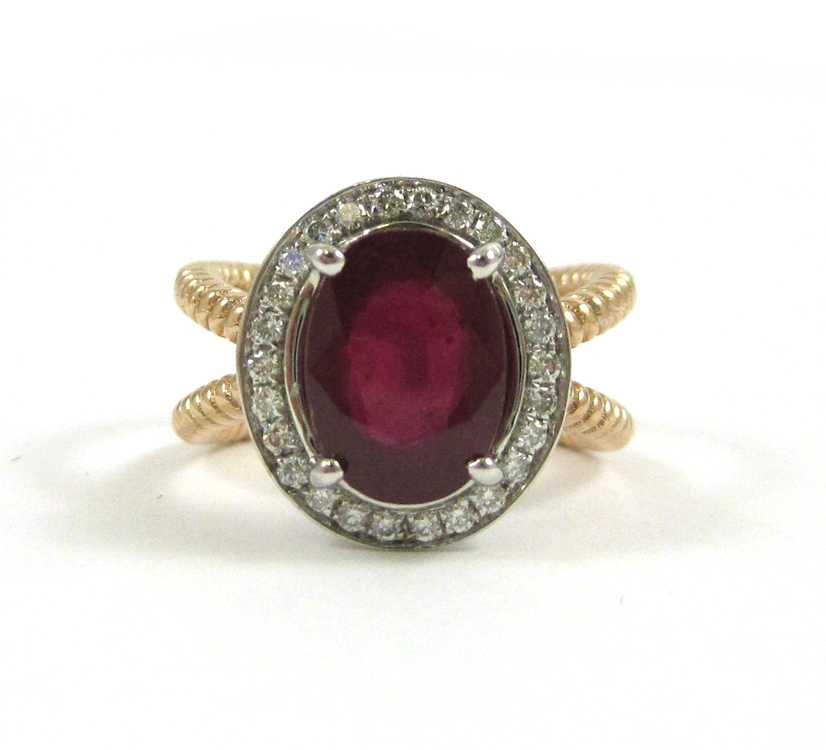 Appraisal: RUBY DIAMOND AND FOURTEEN KARAT GOLD RING The white and