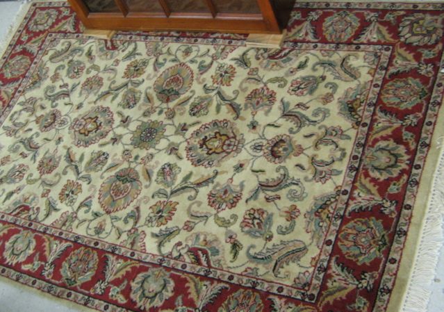 Appraisal: HAND KNOTTED ORIENTAL AREA RUG Indo-Persian overall floral Isfahan design