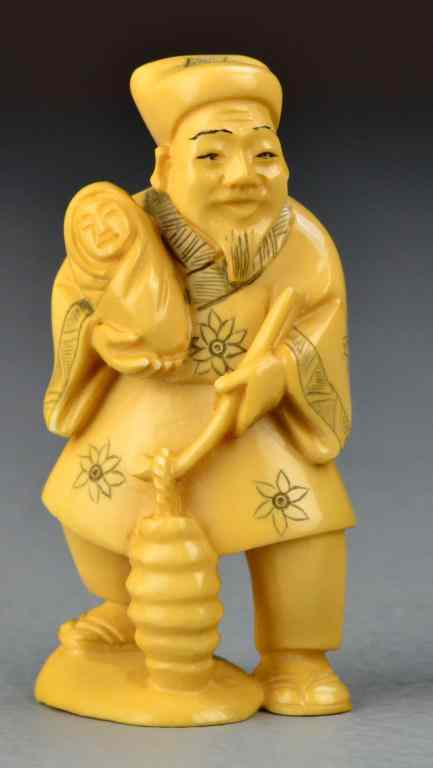 Appraisal: Japanese Carved Ivory OkimonoFinely carved to depict a man holding