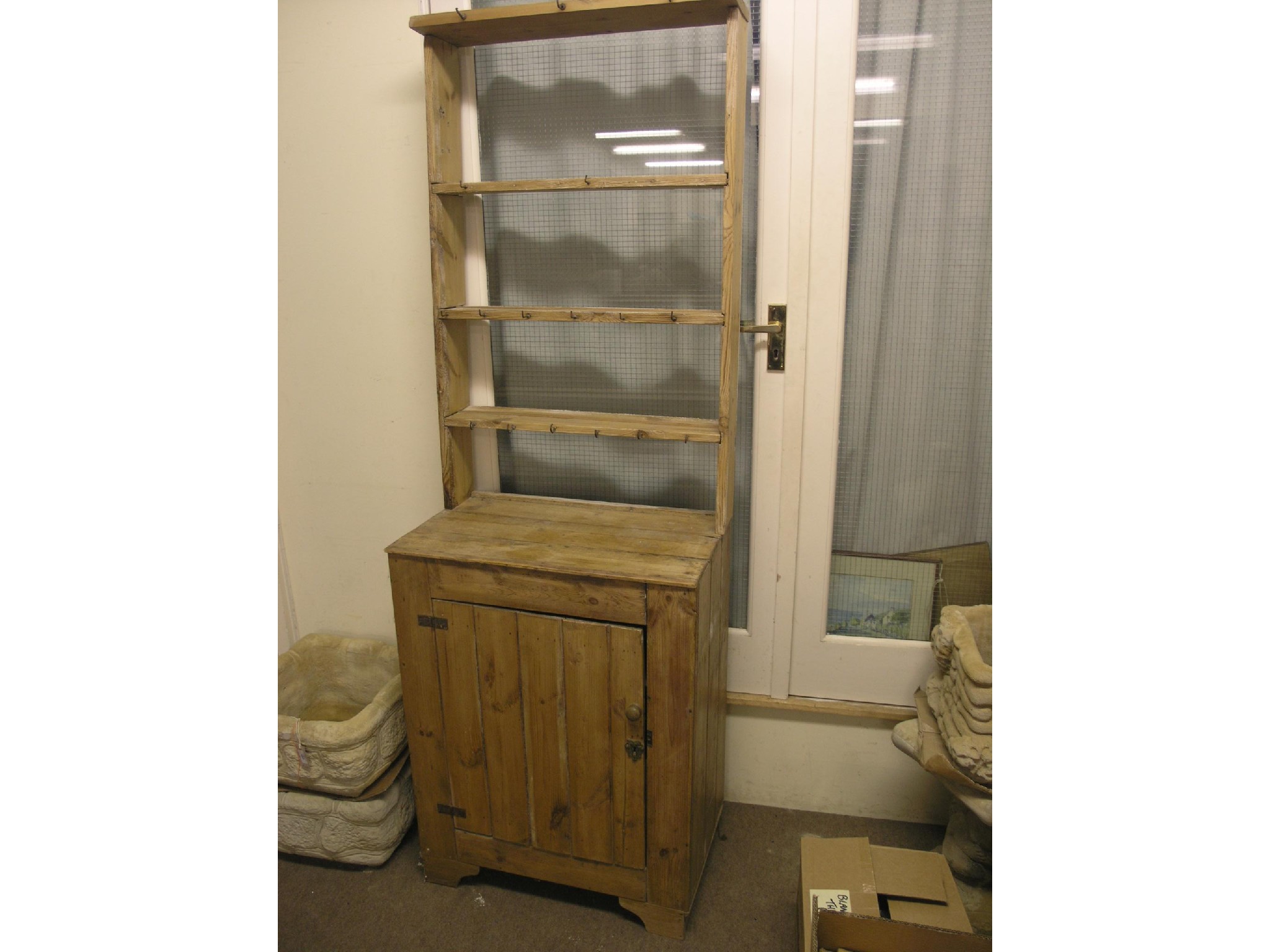 Appraisal: A Victorian stripped and waxed pine cottage dresser three-shelf plate