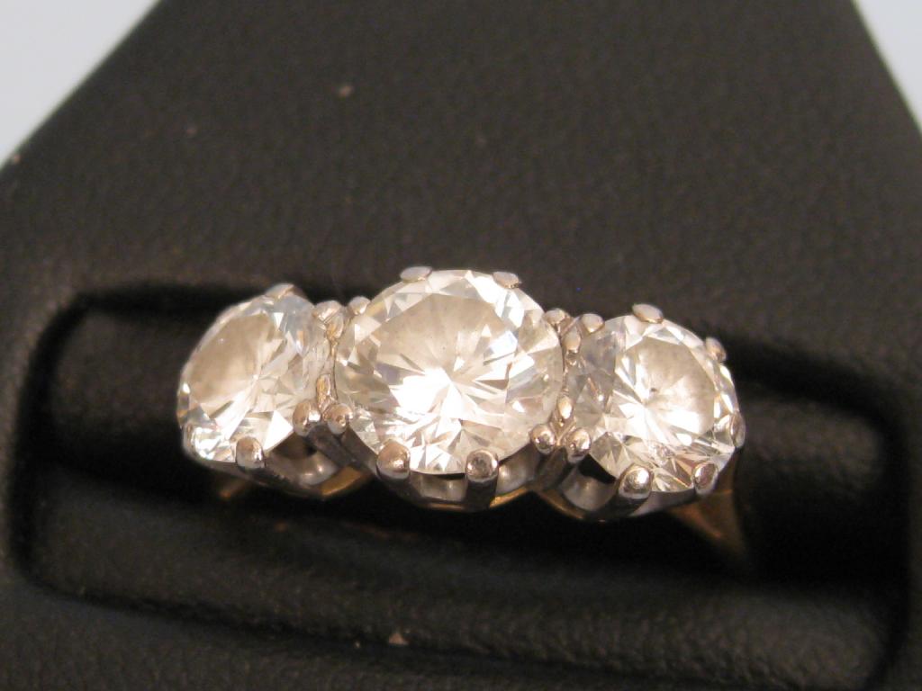 Appraisal: A three stone Diamond Ring the brilliant-cut stones claw-set in