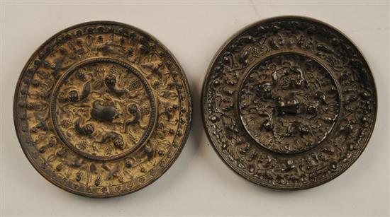 Appraisal: TWO CHINESE TANG STYLE BRONZE CIRCULAR MIRRORS with lion and