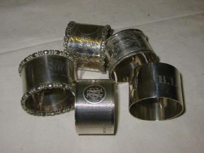 Appraisal: A NAPKIN RING wide chased with initials on plain ground