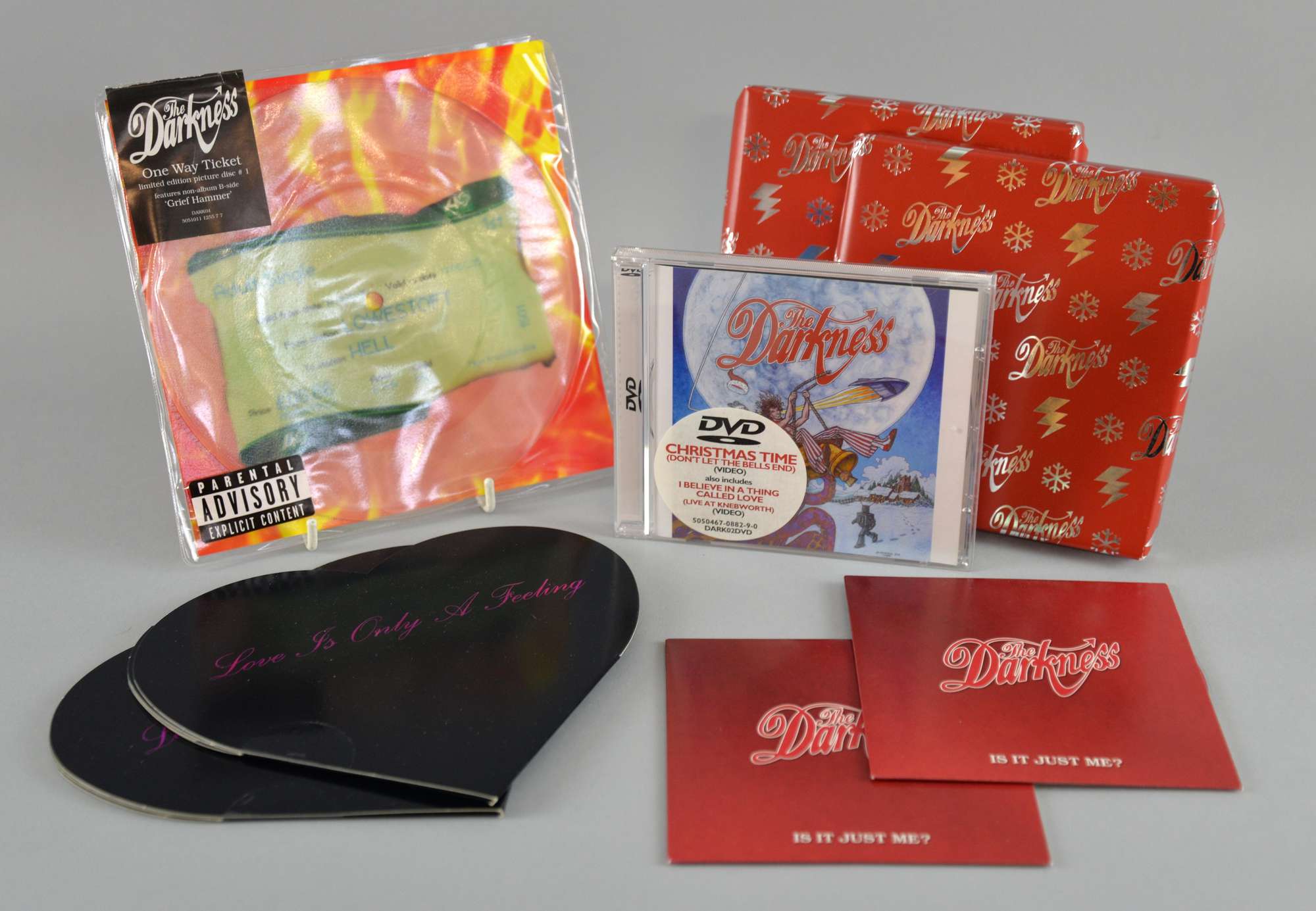 Appraisal: The Darkness all sealed Christmas Time CDs in red wrapping