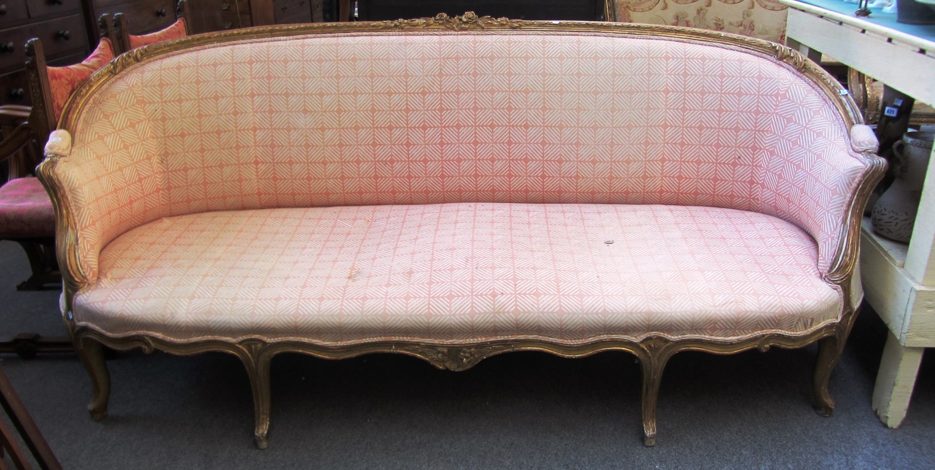 Appraisal: An th century style gilt framed tub back sofa with