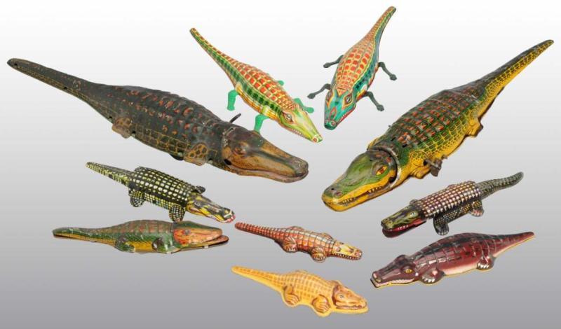 Appraisal: Lot of Tin Litho Alligator Toys Description American Chinese and