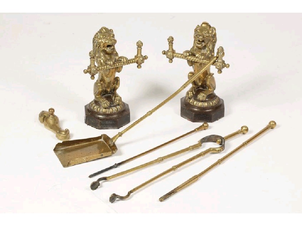 Appraisal: A SET OF THREE GILT BRASS LONG HANDLED FIRE IRONS