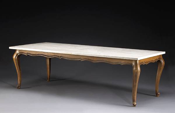 Appraisal: An Italian Rococo style travertine and walnut dining table The