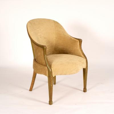 Appraisal: A tub armchair upholstered in pale green fabric with a