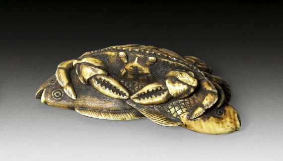 Appraisal: IVORY NETSUKE OF A CRAB Japan th century L cm