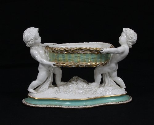 Appraisal: A Copeland bowl supported by putti cm x cm ''