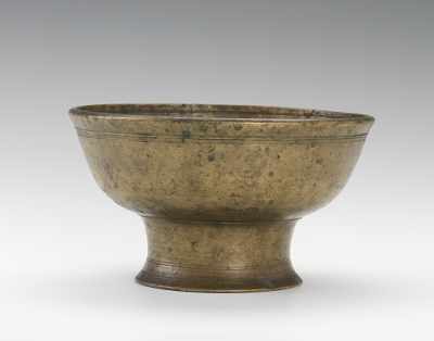 Appraisal: A Bronze Footed Offering Bowl Simply shaped bowl with slightly