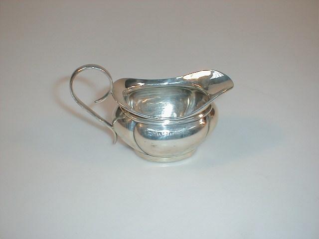 Appraisal: A Victorian style boat shape creamer Birmingham assay