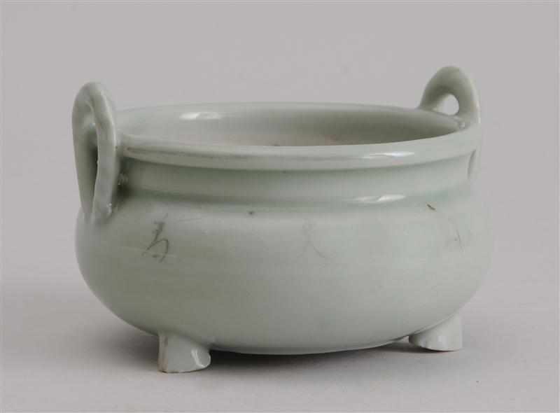 Appraisal: CHINESE CELADON-GLAZED TRIPOD CENSER The squat spherical bowl with rope-twist