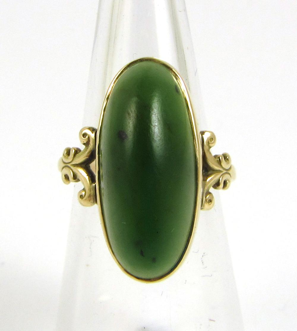 Appraisal: GREEN HARDSTONE AND YELLOW GOLD RING The k yellow gold