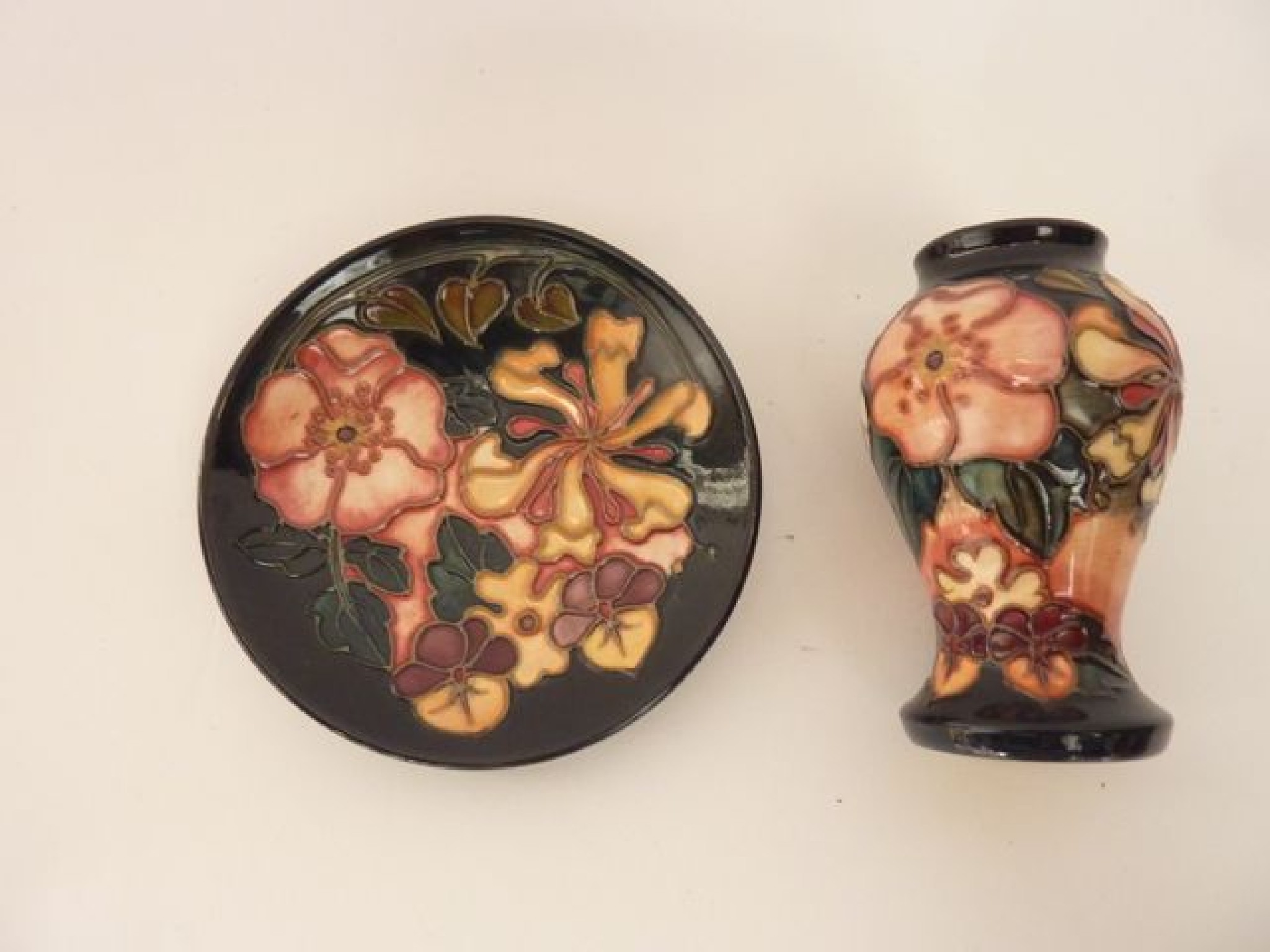 Appraisal: A small Moorcroft vase of baluster shaped form with honeysuckle