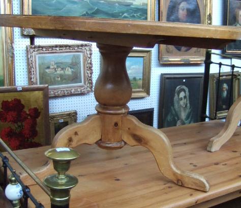 Appraisal: A th century circular pine dining table on tripod supports