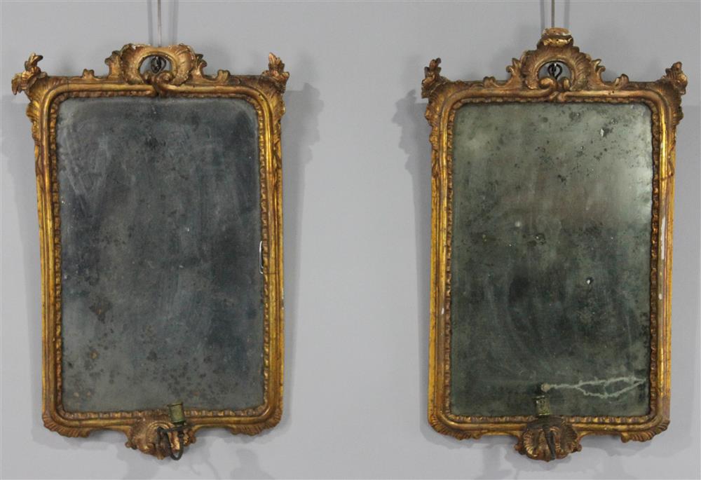 Appraisal: PAIR OF ROCOCO CARVED GILTWOOD MIRRORS WITH CANDLEARM each with